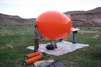 University of Utah graduate students filling the tethered balloon with Helium and preparing it for flight.